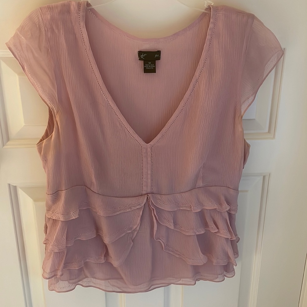Sweet lavender silk top with ruffled bottom. Freshly laundered.
